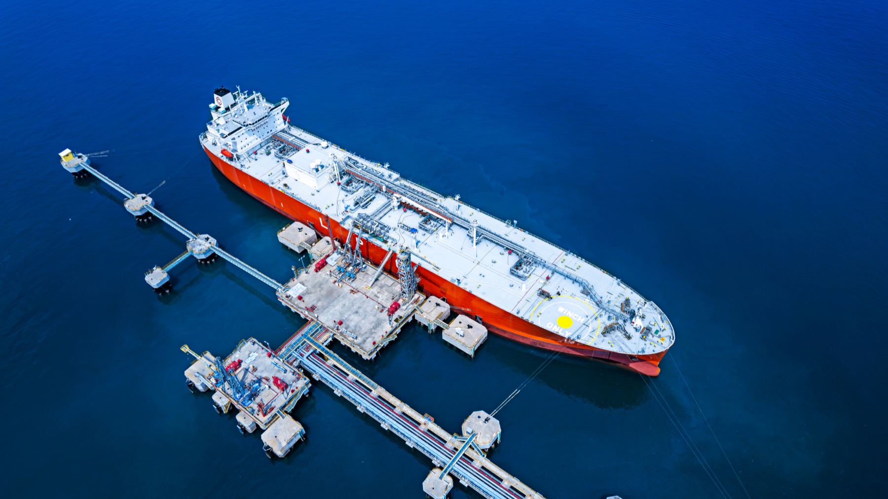 LNG carrier alongside a jetty, aerial view
